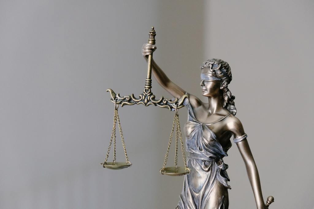 scales of justice representing continuum every crisis is an opportunity