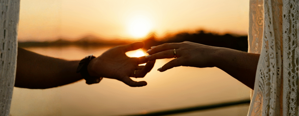 Two hands reaching to each other