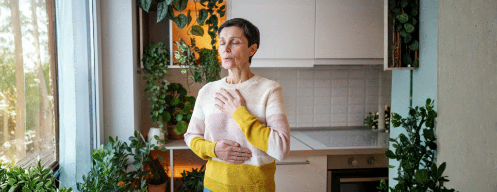 An elderly woman meditating and doing breathwork